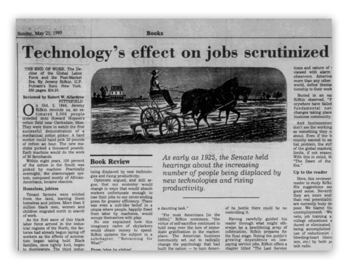 Newspaper titled "Technology's effect on jobs scrutinized" 