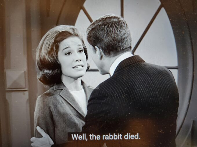 Dick Van Dyke holding Mary Tyler Moore and the text "well, the rabbit died"