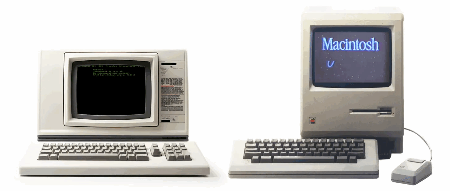 A Macintosh computer next to an old computer system. 